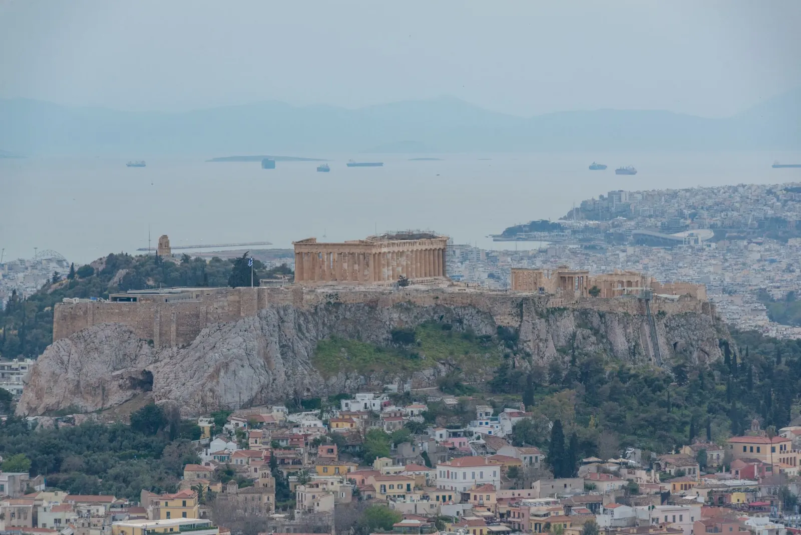 Stunning aerial view of the Acropolis of Athens, showcasing ancient Greek architecture and cityscape.
