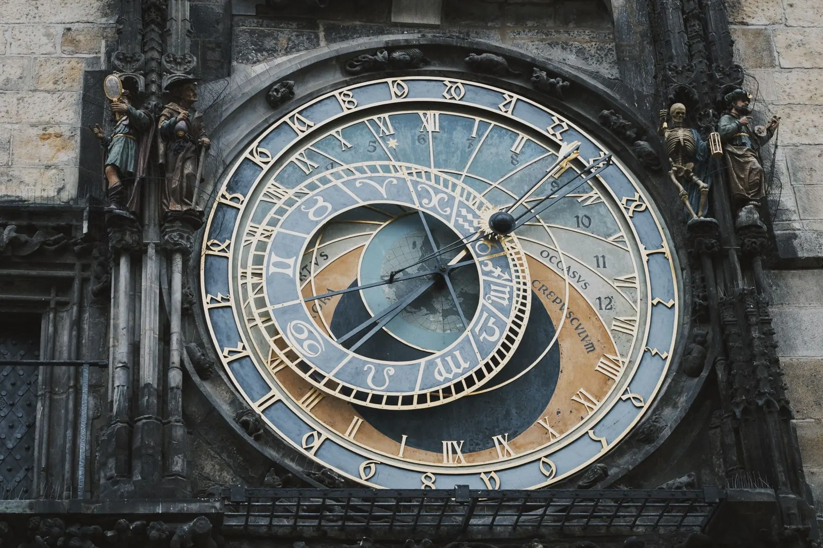 Close-up of the Prague Astronomical Clock with intricate details on a historic building facade.