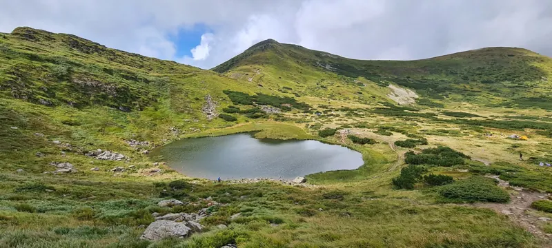 Glacial lake on a Carpathian meadow
