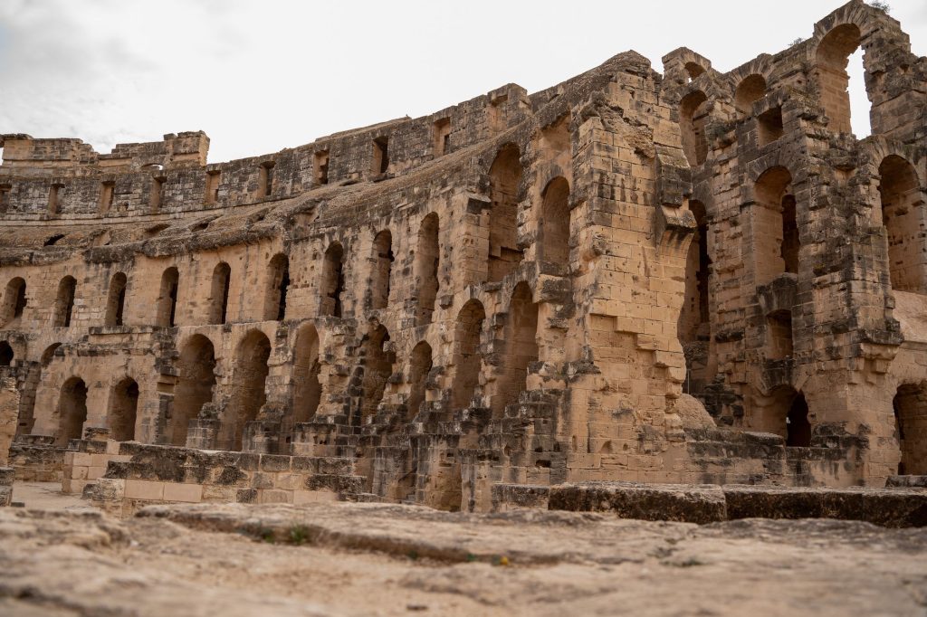Ancient Roman amphitheatre ruins in El Jem, Tunisia showcasing architectural grandeur.