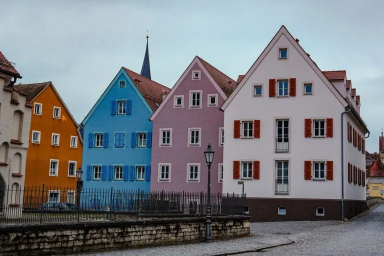 Colourful historic houses on a cobbled street in an old European town