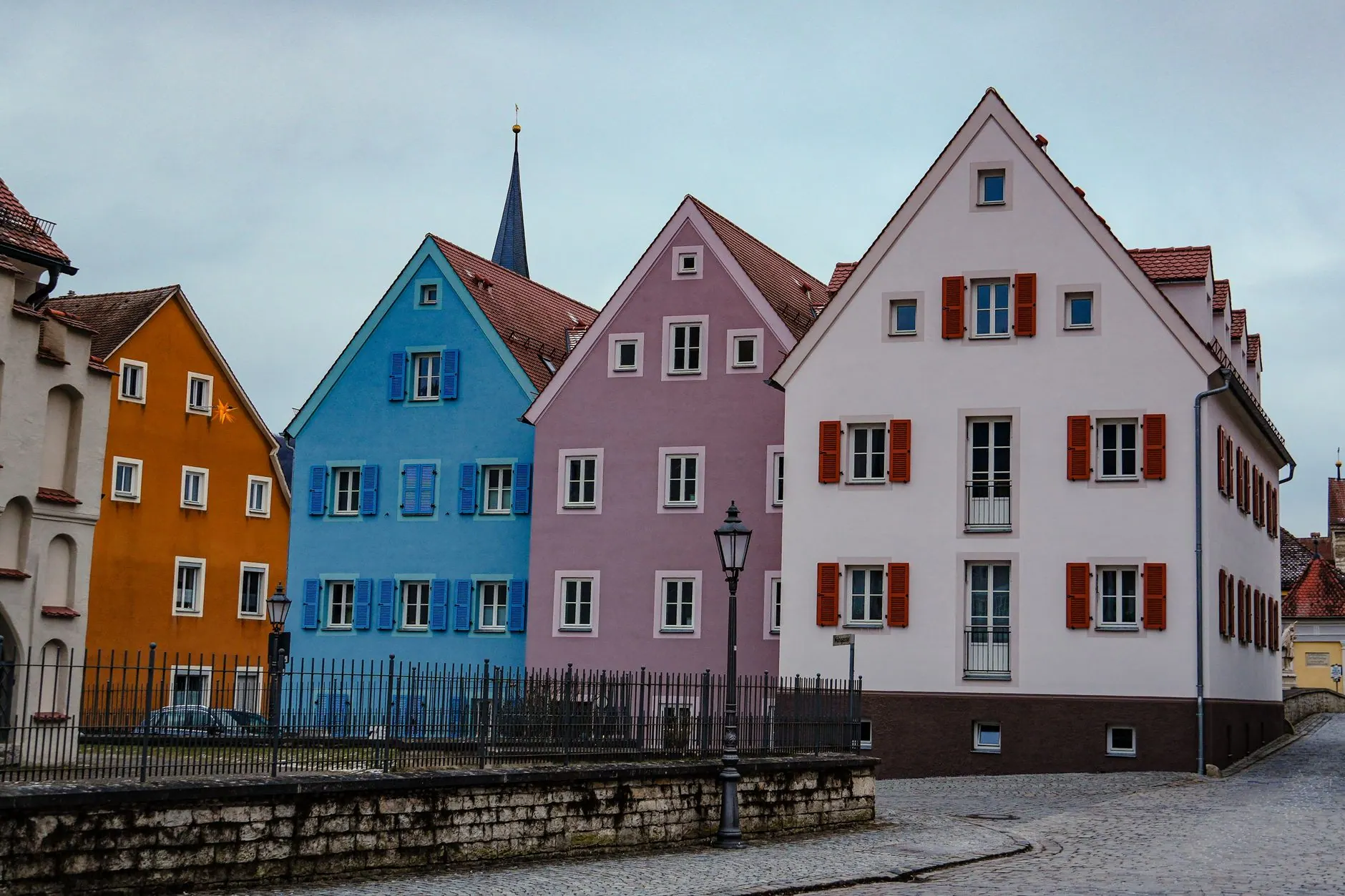 Colourful historic houses on a cobbled street in an old European town