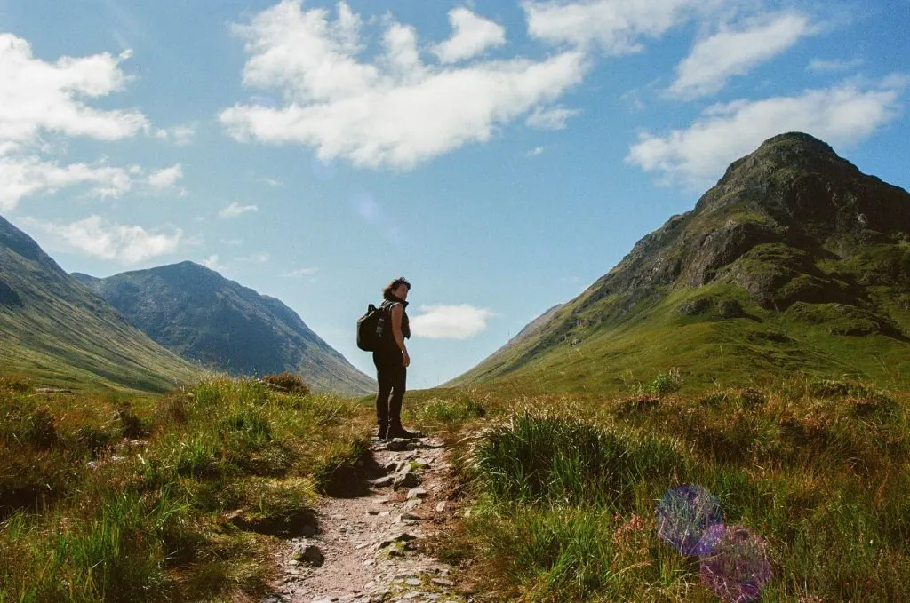 Explore the breathtaking landscapes of the Scottish Highlands with this stunning hiking scene.