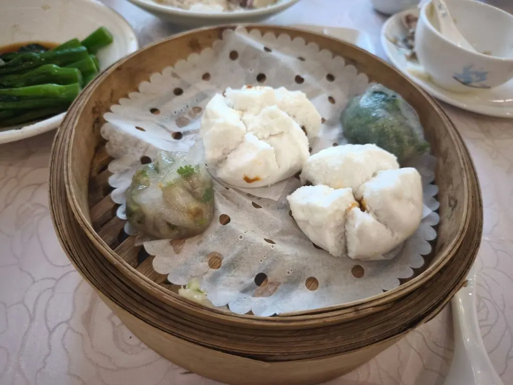 Appetizing dim sum steamed in a bamboo basket, perfect for a savory meal.