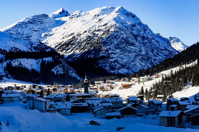 Alpine ski resort village covered in snow