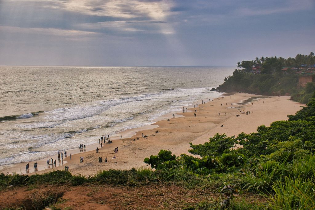 Relax and unwind with this scenic view of Varkala Beach in Kerala at sunset.