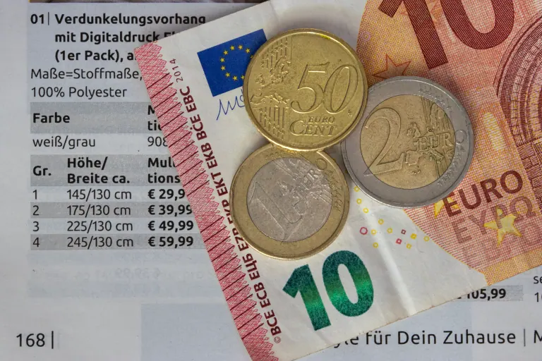 Euro banknotes and coins for a budget trip
