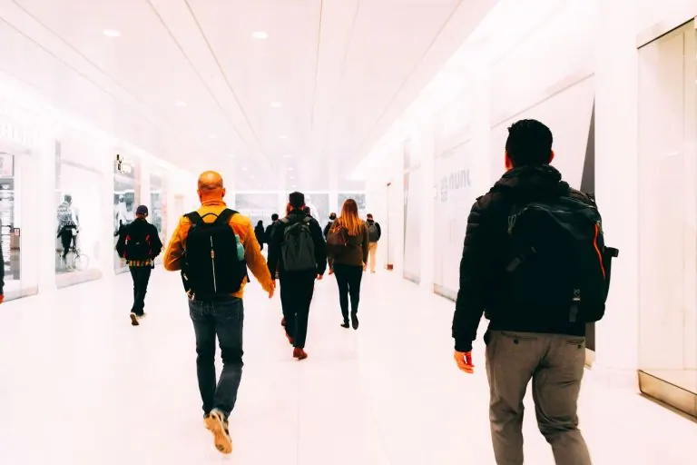 Traveller with a backpack walking through an airport
