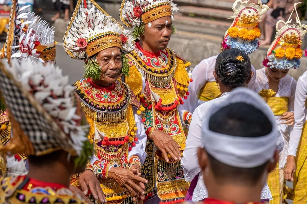 A vibrant showcase of traditional Balinese dance with colorful costumes and headpieces.