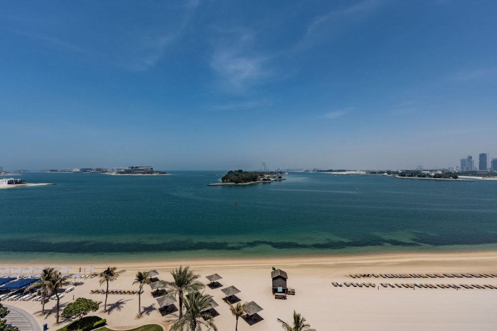 Explore the serene beaches and skyline view of Palm Jumeirah in Dubai, UAE.