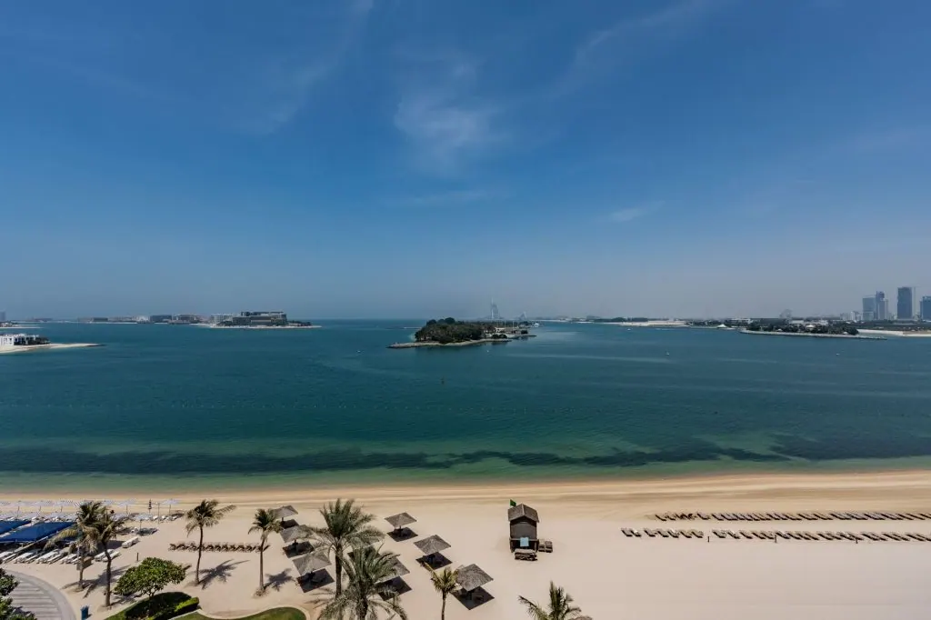 Explore the serene beaches and skyline view of Palm Jumeirah in Dubai, UAE.