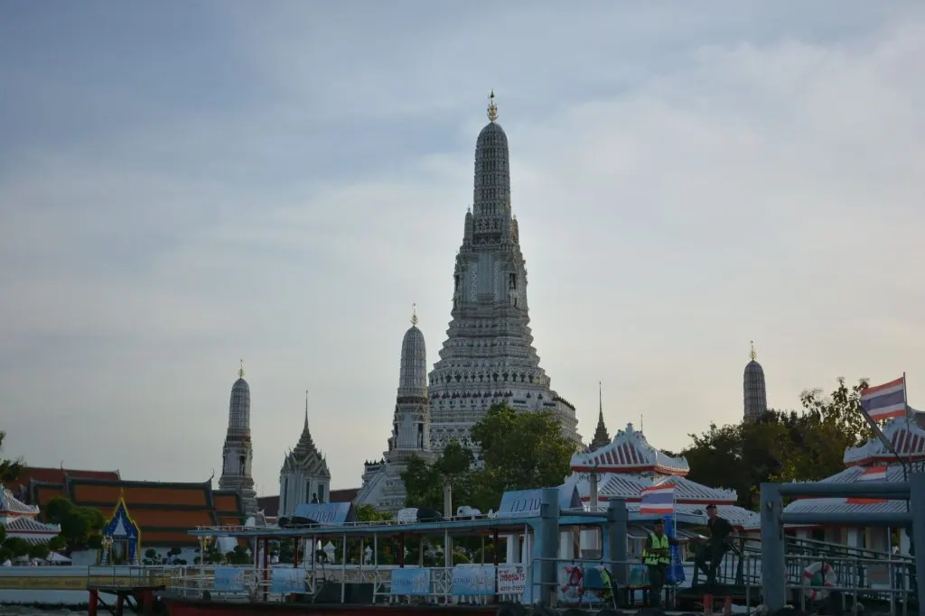 Scenic view of Wat Arun Temple in Bangkok, captured at dusk showcasing its iconic architecture.