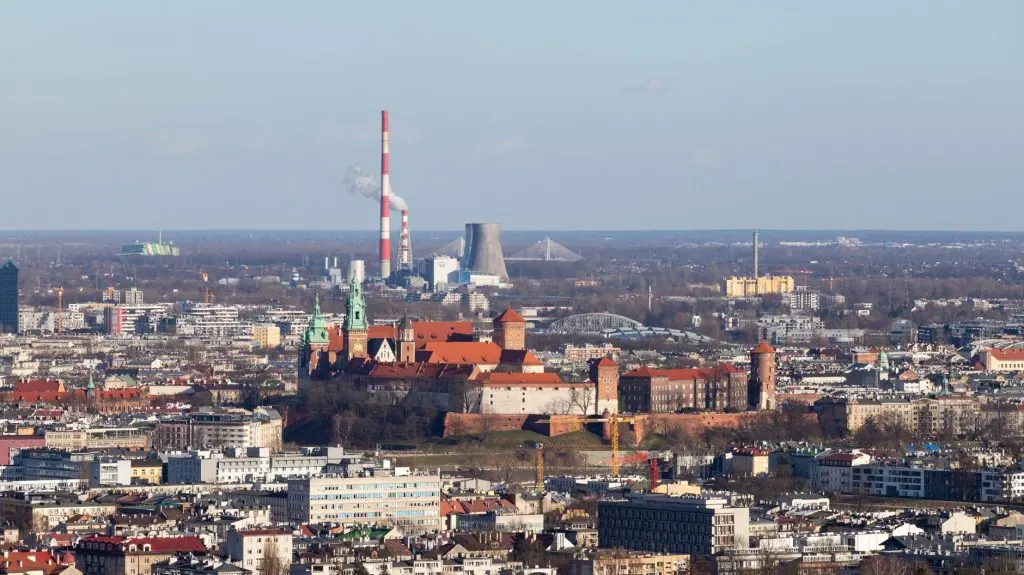 Aerial view of Krakow featuring the historic Wawel Castle and cityscape.