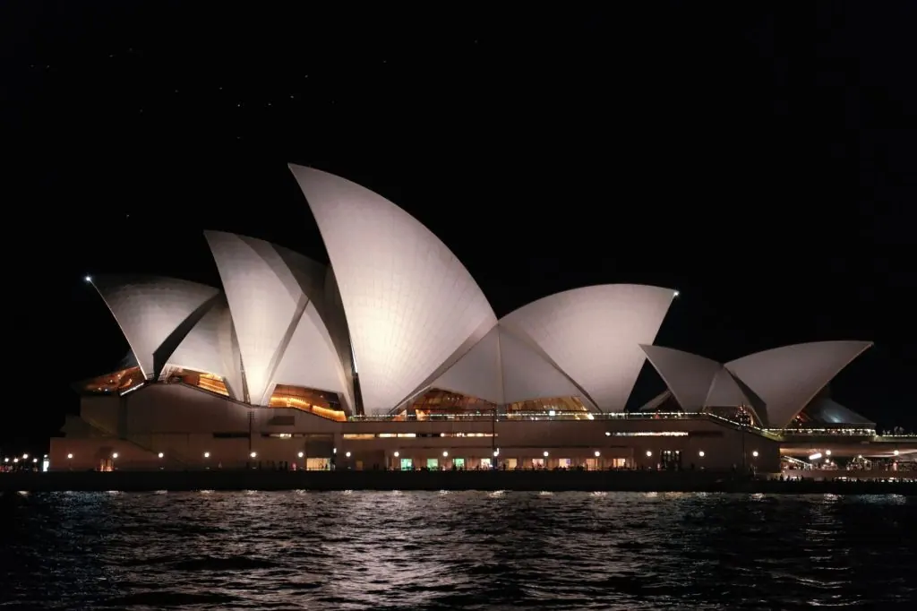 A stunning night view of the Sydney Opera House, a iconic piece of modern architecture in Australia.