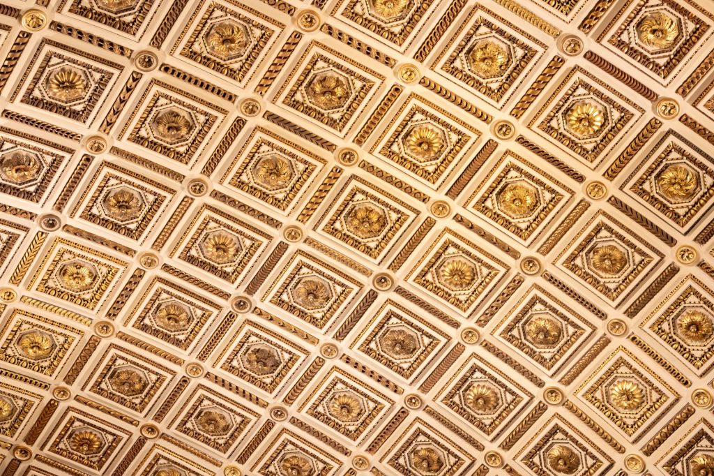 Detailed view of the elaborately designed ceiling at the Uffizi Gallery, Florence, showcasing intricate artistic patterns.