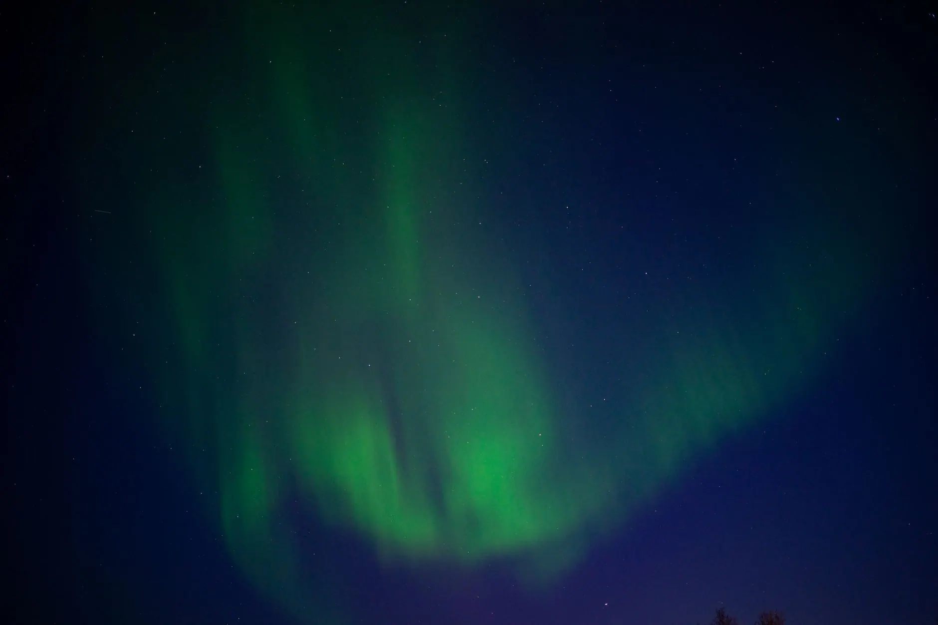 Northern lights over a snowy landscape
