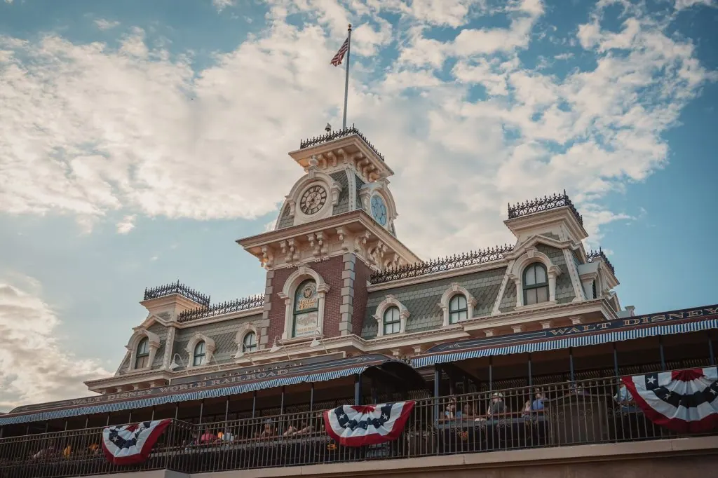 Iconic entrance to Walt Disney World Railroad at Magic Kingdom, Orlando, Florida, with vintage architecture and American
