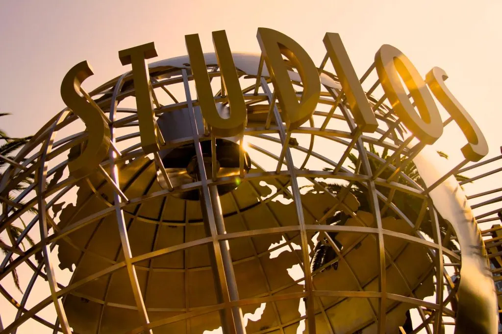 Iconic Universal Studios globe sculpture at sunset, symbolizing Hollywood magic.