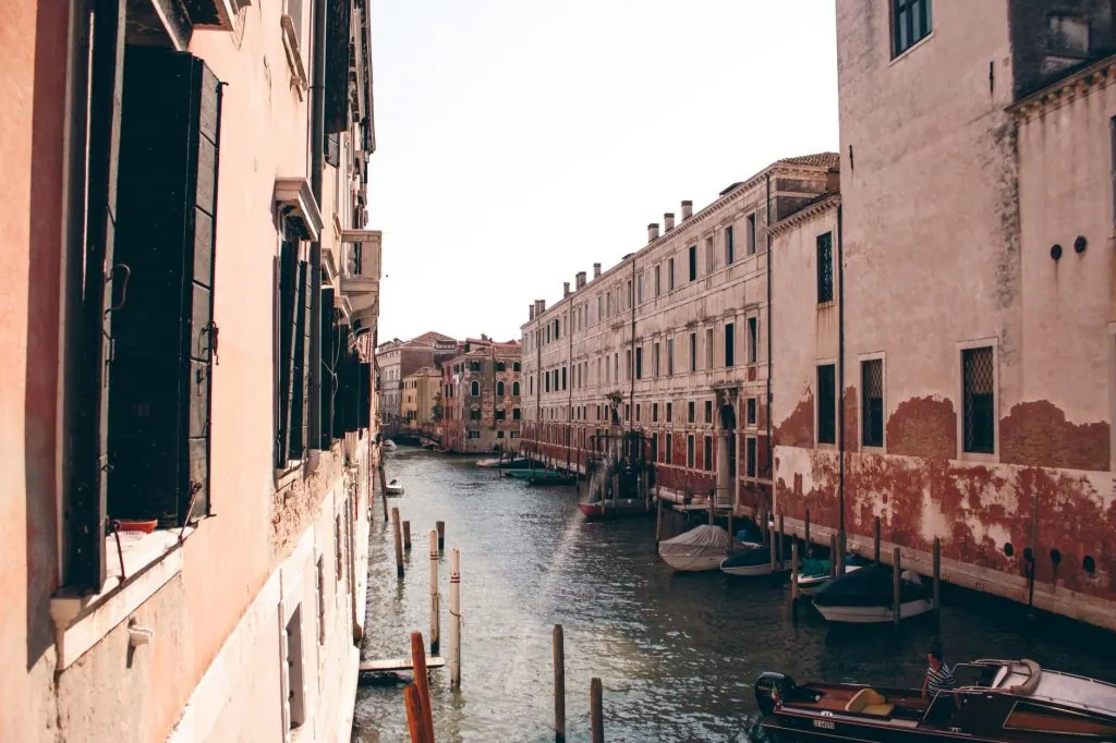 Picturesque view of Venice's historic canals and architecture in warm sunlight.